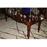 A Victorian mahogany D end extending dining table