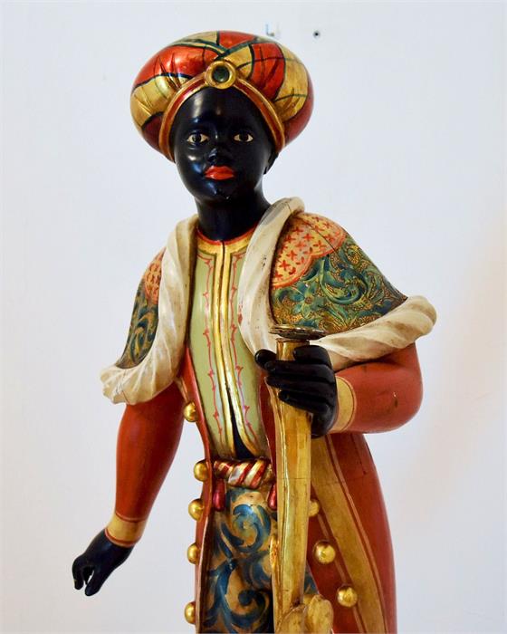 Reproduction Blackamoor figure, standing on a faux marble and gilded base and elaborately and bright - Image 2 of 2