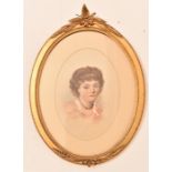 19th century watercolour portrait of a child mounted in carved gilt wood oval frame,