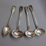 Three Georgian silver ladles and a silver Georgian serving spoon,