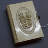 A late 19th Century French prayer book with ivory cover having carved floral detail