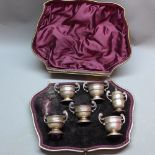 A Victorian silver cased condiment set (one pepperette missing), 1897,