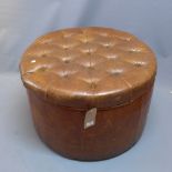 A large early 20th Century brown leather pouffe