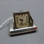 A silver Tavannes Watch Co. rectangular double door desk watch. Marked 0.