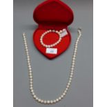 A suite of fresh water pearls to include a necklace, a bracelet and a pair of earnings.