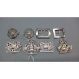 Three Victorian silver belt buckles together with a Persian white metal belt buckle