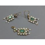 A pair of yellow gold earrings set with pearls and central baguette cut emeralds,