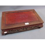 A 20th Century Chinese hardwood rectangular table stand with carved and pierced border and raised