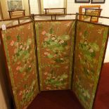 A Chinese three fold bamboo screen with floral decoration.