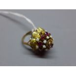 A yellow gold, opal and garnet thai style 'princess' ring,