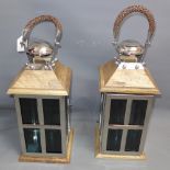 A pair of beechwood and chrome storm lanterns.