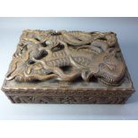 A 20th Century Chinese box carved with three dimensional dragon to the lid