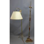 A brass and rosewood twin standard lamp together with one other brass standard lamp.