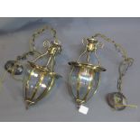 A pair of brass lantern light shades with bevelled glass panels