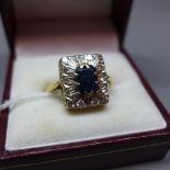 A ladies 18ct gold, diamond and sapphire dress ring,