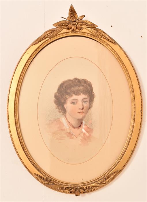 A C19th watercolour portrait of a child mounted in carved gilt wood oval frame,