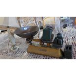 Vintage weighing scales with weights and an onyx table lamp.