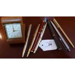 A Looping travel clock together with 7 pens (mostly Parkers)