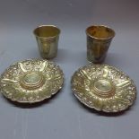 Two white metal beakers together with two white metal dishes. Approx.