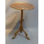 A Victorian gilt wood occasional table, the carved top with leaf decoration,
