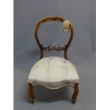 A Louis Phillippe walnut back low chair