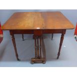 A 19th Century mahogany Sutherland table raised on turned legs and castors joined by stretchers.