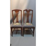 A pair of mahogany splat back art deco chairs with tapestry seats.