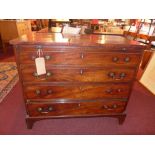 A Georgian mahogany chest of four drawer, raised on carved bracket feet.