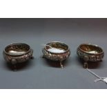 Three Victorian silver salts, London 1860 Robert Hennell, repousse embossed design,