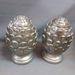 A pair of garnitures in the form of acorns.