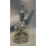 A fine quality silver mounted claret bottle in classical style with etched glass body.