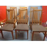 A set of six teak dining chairs.