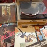 A Pioneer record player together with a selection of 70's vinyl records.