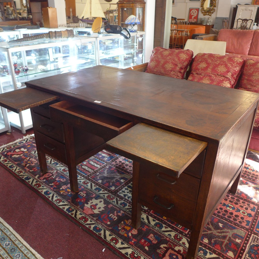 A Mid 20th century oak desk, frieze drawer flanked by an arrangement of three drawers to each side, - Image 2 of 2