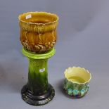 A jardiniere stand in green along with two jardinieres one brown glaze,