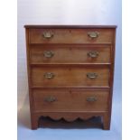 A Georgian style mahogany chest of four graduating drawers, raised on bracket feet.