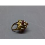 A yellow metal opal and garnet set princess ring.