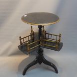 A Victorian ebonised occasional table with partial gliding, raised on three splayed legs.