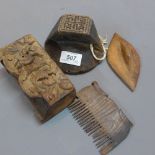 Four tribal wooden items to include two stamps