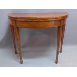 A 19th Century mahogany foldover tea table with box wood inlay,