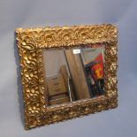 A 19th Century carved giltwood mirror with bevelled glass plate.