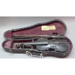 An antique apprentice miniature model of a violin in original case