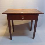 A 19th Century oak side table with single drawer and raised on tapered legs.