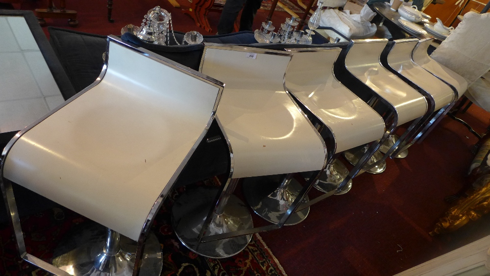 A set of six chrome framed bar stools.