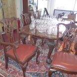 A set of six Chippendale style mahogany dining chairs with matching extending dining table.