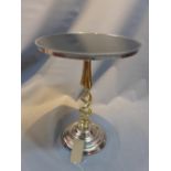 A contemporary marble top occasional table raised on brass barley twist supports on chrome base.