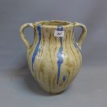 A contemporary studio art pottery twin handled vase having drip glaze.