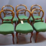 A set of 6 Victorian walnut balloon backed dining chairs with green upholstery