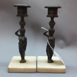 A pair of candle sticks on square marble base H:18cm