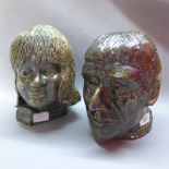 A pair of contemporary pottery heads, depicting one gentleman and a female child.